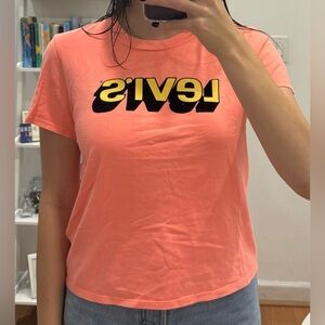 Levi’s - Babydoll tee, size S, coral with yellow/black lettering